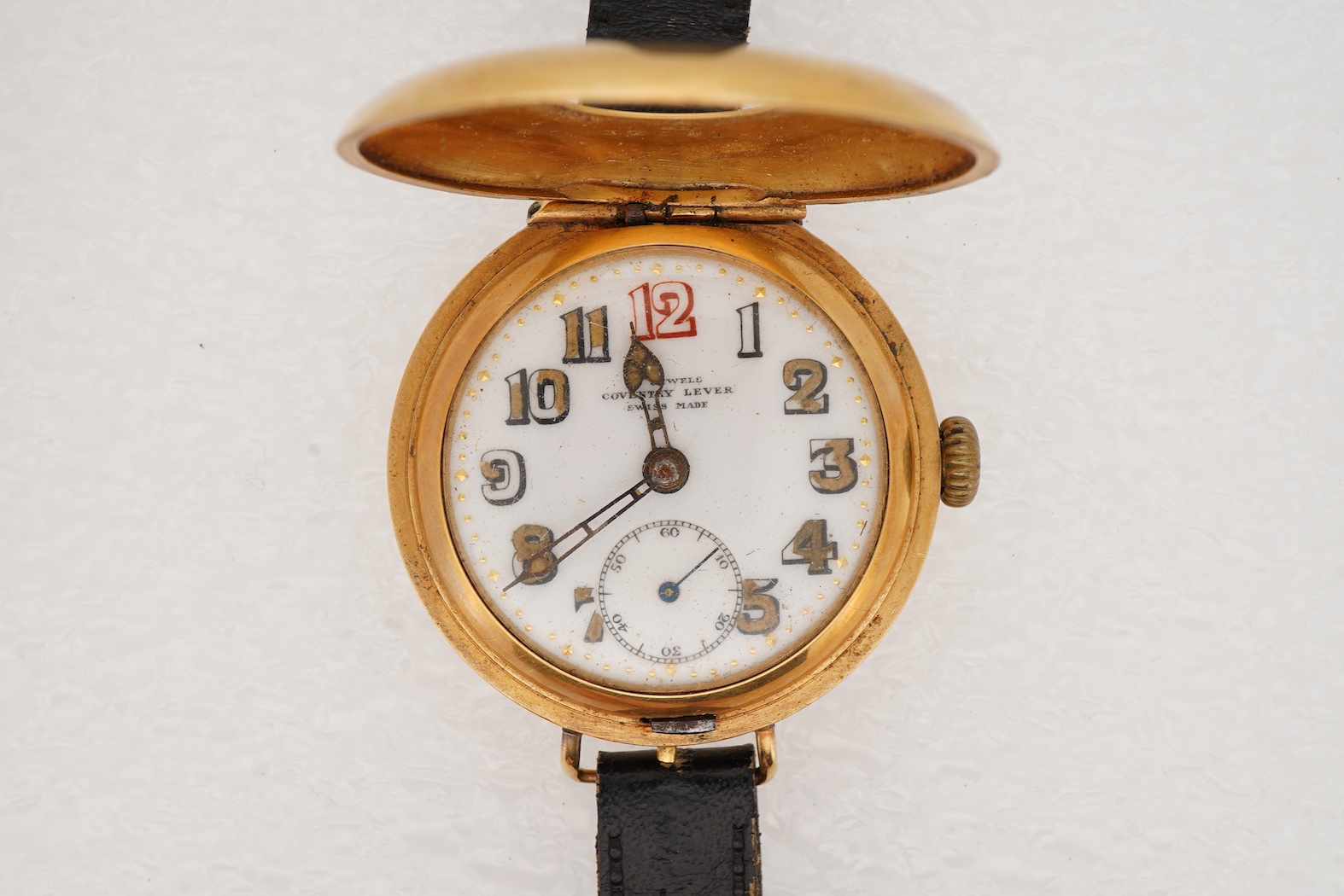 A gentleman's early to mid 20th century 18ct gold half hunter Coventry lever manual wind wrist watch